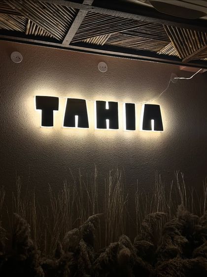 A close-up of the "Tahia" sign. This is a great branding shot for the restaurant.