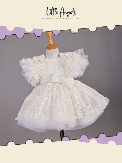 Our Princess White Short Dress, featuring delicate lace, a bow at the waist, and a classic puffy skirt.