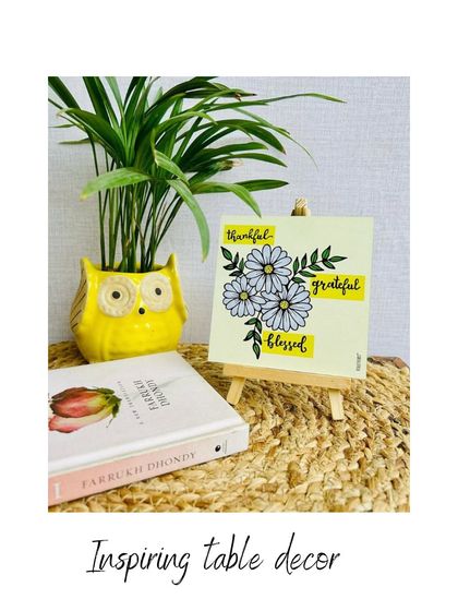 A collection of our inspiring table decor, including our hand-doodled tabletops with a mini easel. These are perfect for your desk, shelf, or as a thoughtful gift for someone special.