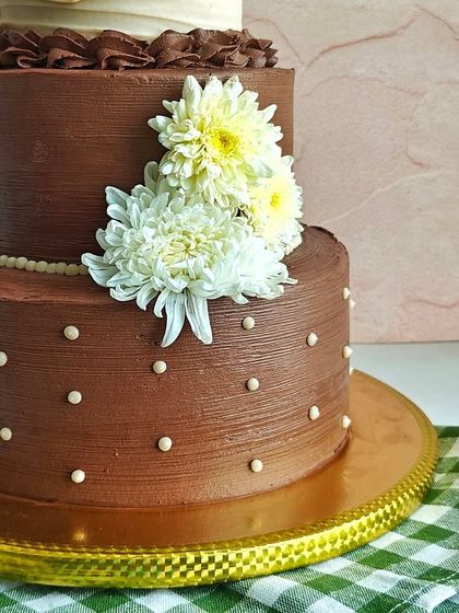 A close-up of the middle and bottom tiers. I used piped pearls and polka dots to add subtle, classic details.