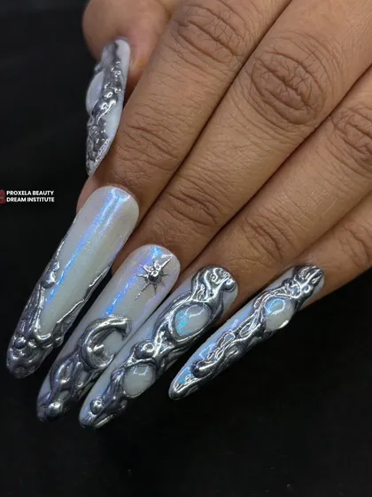 A still shot of the futuristic 3D silver nails, highlighting the liquid-like texture and the embedded opal-like stones that catch the light beautifully.