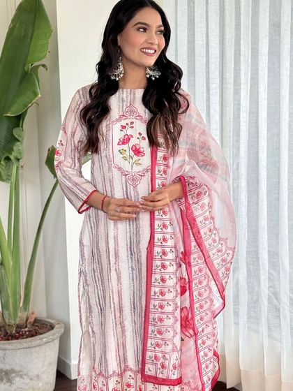 This off-white pure muslin kurta set is all about subtle stripes and floral details. It's a versatile piece that you can style for both casual and semi-formal occasions.