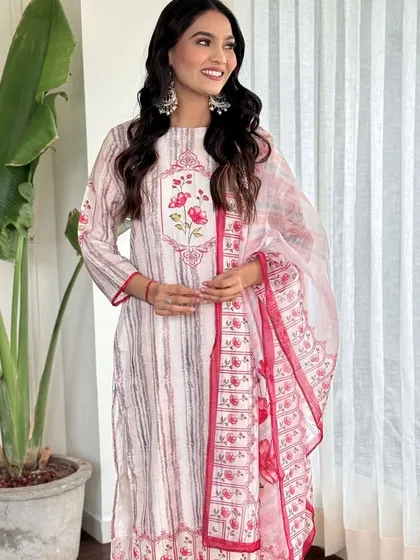 This off-white pure muslin kurta set is all about subtle stripes and floral details. It's a versatile piece that you can style for both casual and semi-formal occasions.