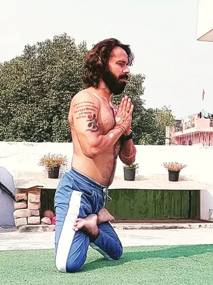This is Lotus Mountain pose, a posture that requires balance, strength, and focus. My 20 years as a Yoga Acharya have taught me that yoga is the journey of connecting the body, mind, and spirit.