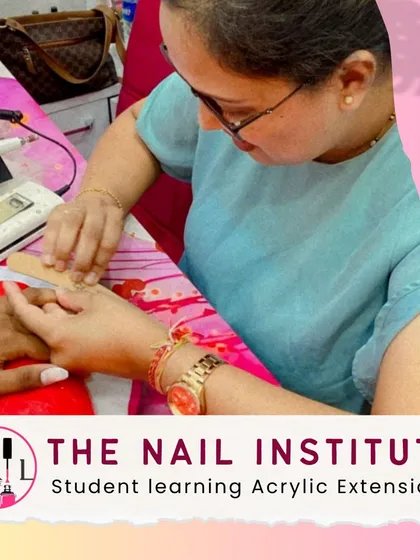A student practices shaping an acrylic extension using both an e-file and a hand file to achieve the perfect structure and smoothness.