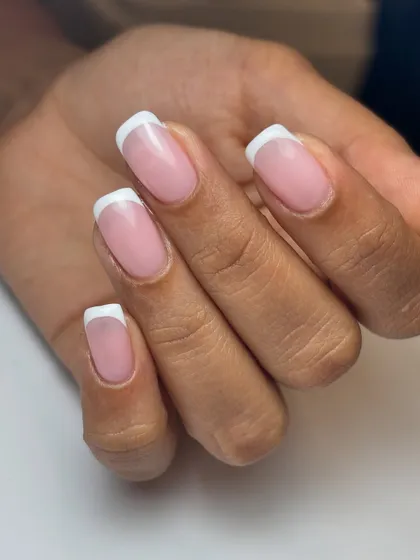 A perfect, classic French manicure. The lines are crisp, the base is a natural sheer pink, and the result is effortlessly elegant.