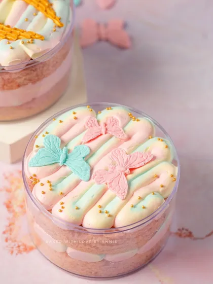 Another look at my whimsical Vanilla & White Chocolate Mousse Cake Tubs, this time adorned with delicate pastel butterflies. It’s a dessert that’s as beautiful as it is tasty.