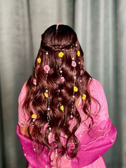 The details matter. This image shows the delicate braid at the crown that serves as the base for the floral strings.