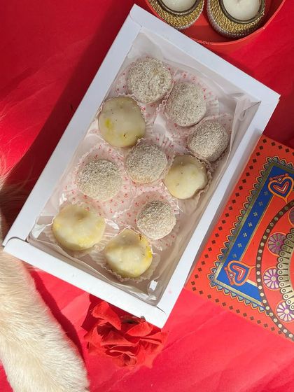 A full view of our Ganesh Chaturthi box, filled with nine delicious, pet-safe modaks and ladoos, perfect for celebrating the festival.