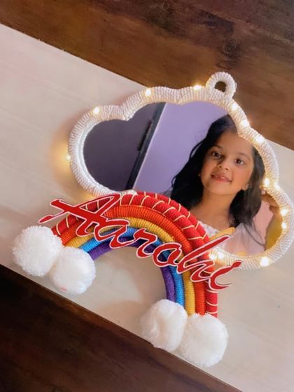 Another lovely photo of a client enjoying her personalized cloud mirror. It's so rewarding to see my creations bring smiles to their new owners.