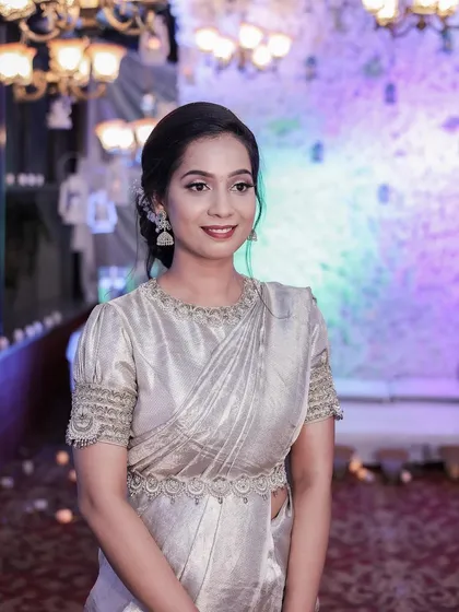A gorgeous reception look. The silver saree is paired with a simple, elegant bun and minimal jewellery for a very classy style.