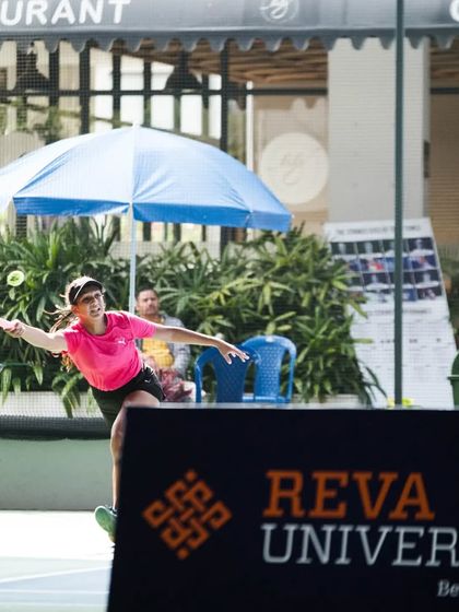 A player hits a running forehand during a tournament hosted at our facility, demonstrating her ability to play offensively on the move.