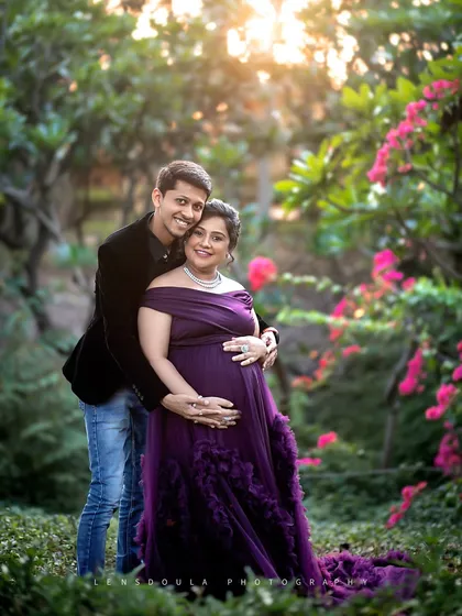 Golden hour in the garden. The sunlight filtering through the trees creates a magical, glowing effect around the happy couple.