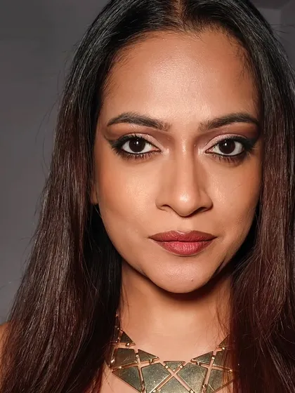 A direct, close-up shot of the eye makeup. The sharp lines of the eyeliner contrast with the soft blending of the eyeshadow, creating a look that is both bold and sophisticated.