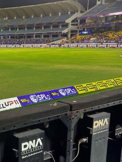 Our DNA-branded LED hardware on the boundary line at the Saurashtra Premier League. This shows our proprietary equipment that powers the visuals at major sporting events.