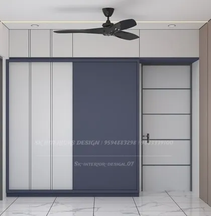 A variation of the sliding wardrobe design, showing how different color combinations can change the room's mood. The clean lines and full-height doors maximize storage.