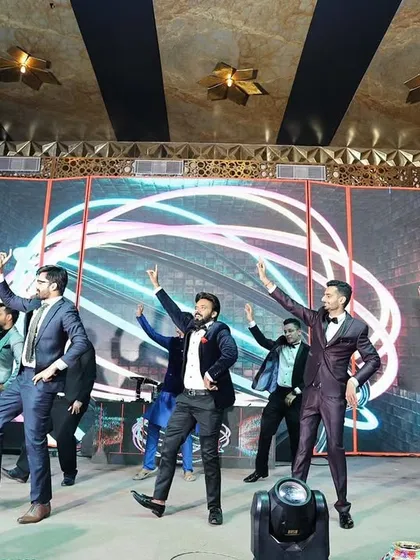 All the dapper men in the house. A powerful, synchronized performance by the groom and his friends.