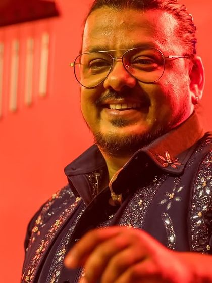 A warm smile from our percussionist, sharing the joy of music with the audience.