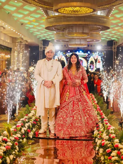 This is the moment it all comes together. I ensure the couple's entry is flawless, coordinating the reflective mirror aisle, the floral borders, and the sparkling cold pyro for a picture-perfect memory.