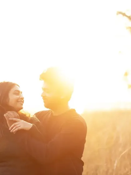 A tender embrace as the sun shines brightly behind them. This golden hour shot is filled with warmth and light, perfectly reflecting the love between the couple.