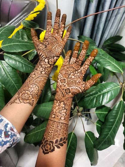 A full view of both hands, showcasing the complementary yet distinct patterns.