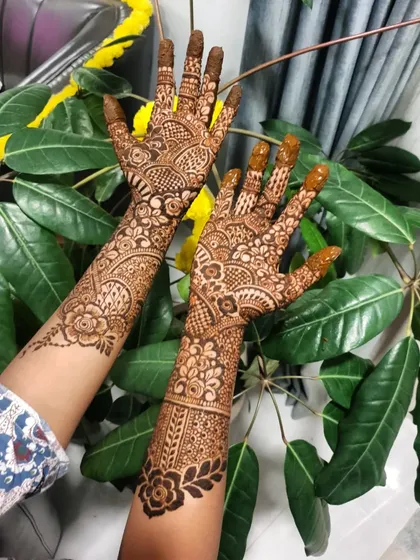 A full view of both hands, showcasing the complementary yet distinct patterns.