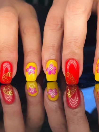 A full view of the festive and colorful floral nail art.