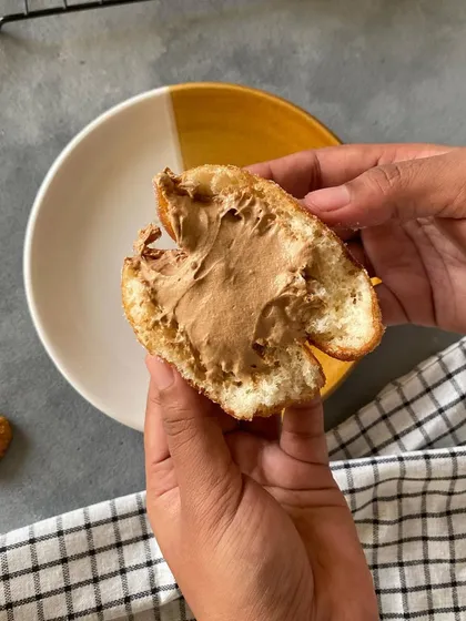 The inside of a Biscoff doughnut, showing the creamy, generous filling. I make sure every bite is packed with flavor.