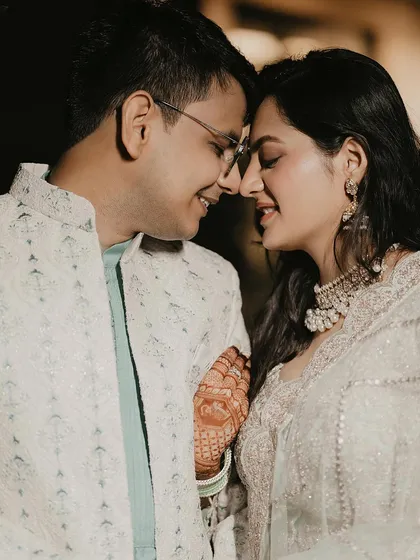 The beginning of forever. This intimate close-up from a roka ceremony captures the gentle, unspoken connection between the couple, their smiles reflecting the happiness of their commitment.