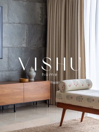 The 'Vishu Home' project, a collaboration we are very proud of, was featured for its unique blend of modern aesthetics and traditional Indian roots. This image captures the living area's material contrast of stone and wood.