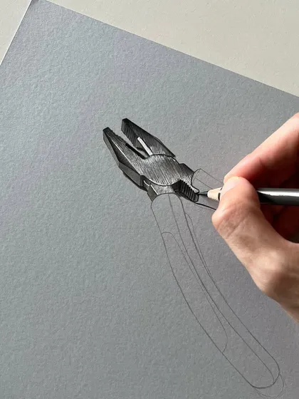 A close-up of the plier drawing process. You can see the pencil strokes used to create the texture of the metal.