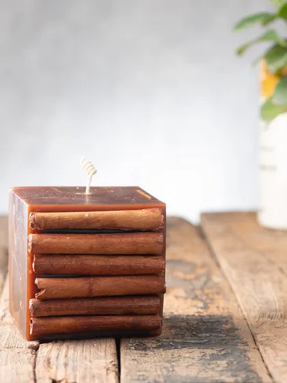 A square version of my cinnamon candle, with layers of cinnamon bark creating a beautiful, rustic texture.