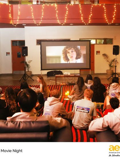 The high school atrium is transformed into a cozy movie theater for Senior Movie Night. It's a perfect chance for our graduating class to unwind and enjoy a classic film together.