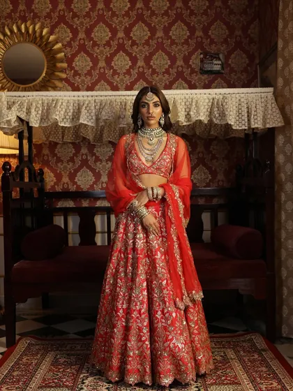 Another view of this vintage-inspired shoot, showing the bride's confident posture and the beautiful fall of the heavily embroidered lehenga.