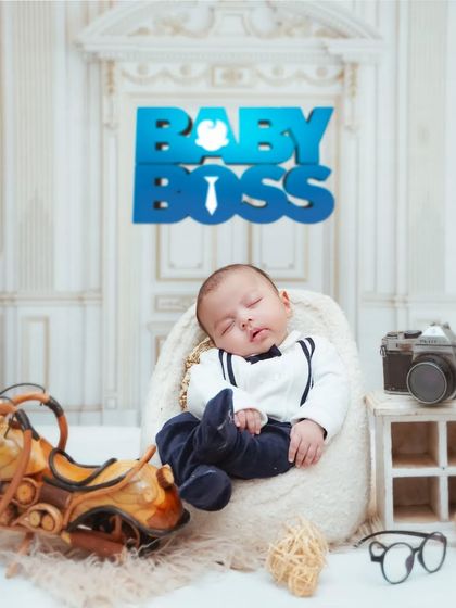The "Baby Boss" theme is a fun and playful option for newborns. Even while sleeping, this little one looks ready to take on the world.