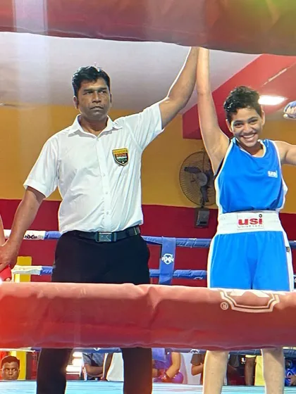 The moment of victory for Vedika Satre as the referee raises her hand, qualifying her for the National Boxing Championships.
