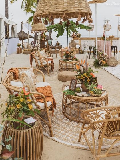 A lounge area with natural cane and wicker furniture, creating a comfortable and stylish spot to enjoy the ocean breeze.