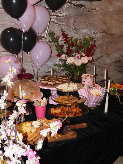 This is what we live for: creating a full party spread that makes your celebration feel extra special. This dessert table for a home party features a mix of our sweet and savory treats, including a custom cake, dessert cups, a cheese platter, and of course, pretty decor to match.