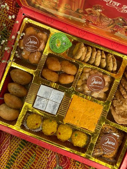 Let's take the traditional route this wedding season. This Bhaji Box is filled with classics like Kaju Katli, Motichoor Laddoo, and crispy mathri, making it a thoughtful return favour for your guests.