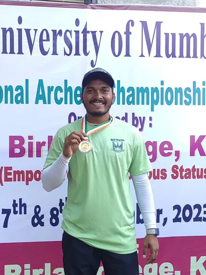 One of our compound archers with his silver medal from the University of Mumbai championship. We provide specialized coaching for different archery styles.