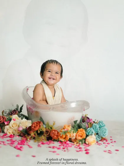 An artistic edit of the bath time shoot, with a faint overlay of the baby's face, adding a dreamy and memorable quality to the portrait.