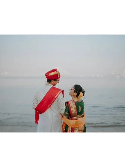 A classic Mumbai pre-wedding shoot with the iconic Bandra-Worli Sea Link in the background. Dressed in beautiful Maharashtrian attire, the couple looks towards their future together, creating a portrait that is both personal and rooted in the city's landscape.