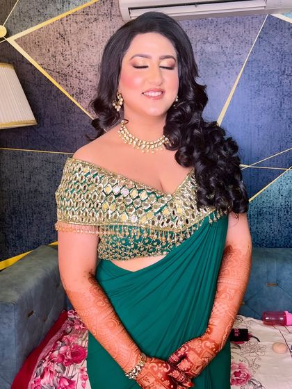 A moment of serene beauty. The soft, glowing makeup and luxurious waves create a look of pure elegance.