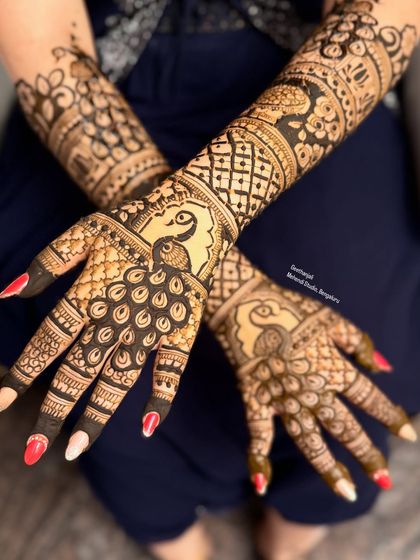 A view of the peacock design with arms crossed, showing the full pattern.