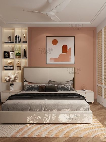 This bedroom uses a warm peach accent wall and natural wood tones to create a cozy and inviting space. The built-in backlit shelving adds a place for personal trophies and decor.