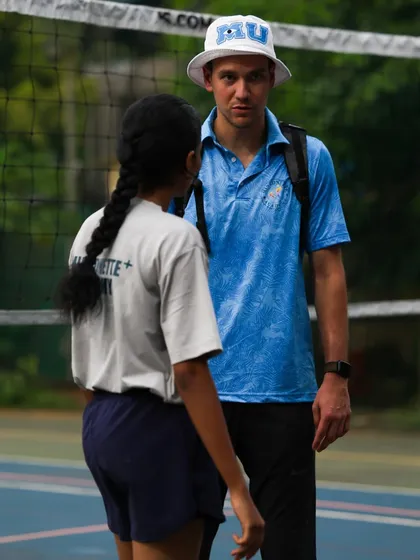 A moment of instruction with a young player. My goal is to be more than a coach; it is to be a role model.