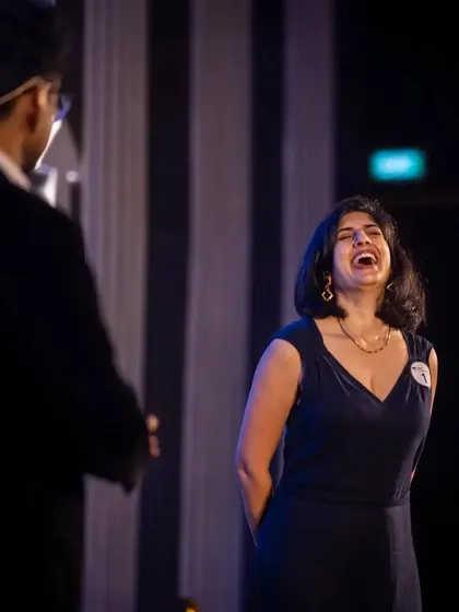 A guest laughing uncontrollably on stage with me. My interactive routines are all about creating fun, shared experiences.