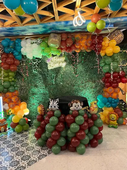 The complete stage setup for the animal-themed party.