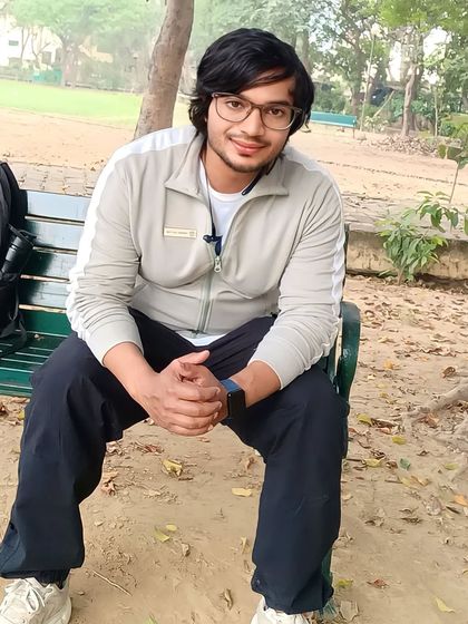 Taking a break on a park bench. I enjoy outdoor activities as part of a balanced fitness lifestyle.