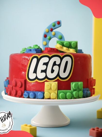 A fun and colorful LEGO cake for a 6th birthday. This bright red cake is covered in edible LEGO blocks, perfect for a young builder.